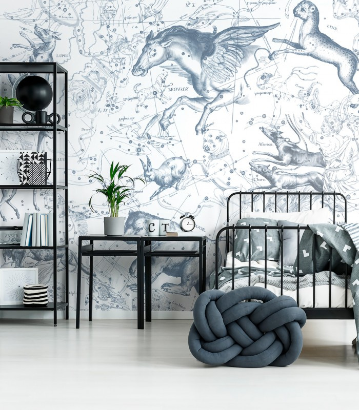 Tapeta Astral Blue Wallcolors z motywem gwiezdnych zwierząt na ścianie w pokoju młodzieżowym