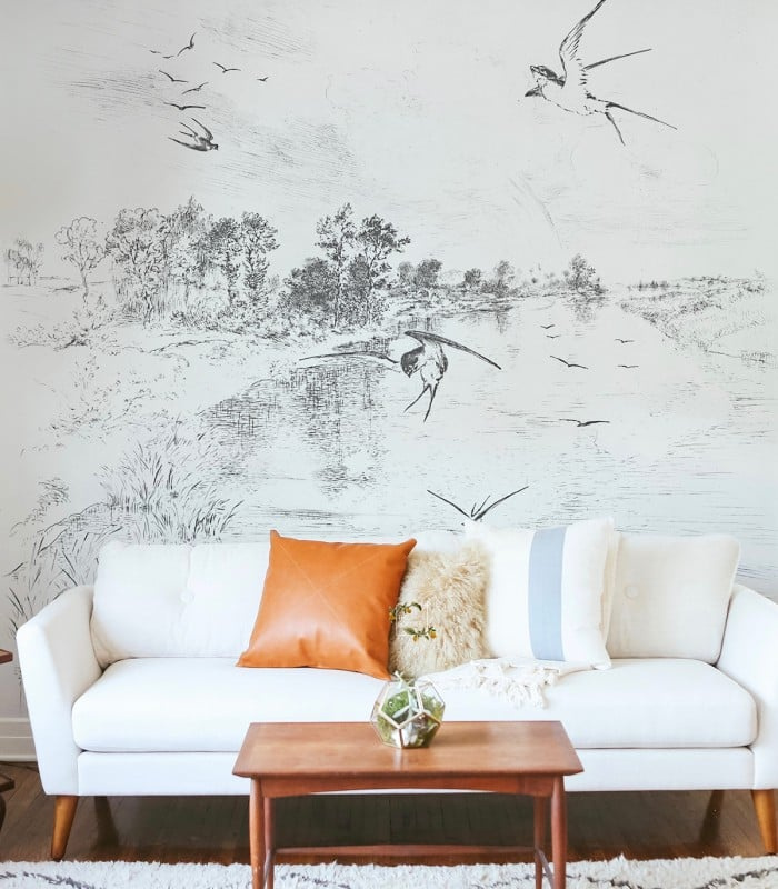 Tapeta Swallow Wallcolors - pejzaż z jaskółkami w salonie