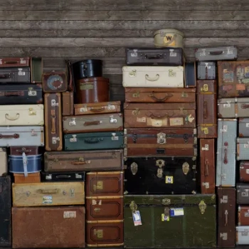 R14061 – fototapeta Stacked Suitcases Rebel Walls