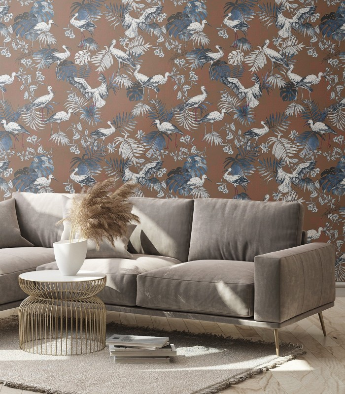 Tapeta Storks Red Wallcolors w salonie – ceglane tło z motywem bocianów i liści